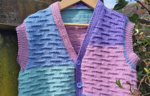 Child’s button up vest using caterpillar stitch in 8 ply knitting pattern - Image 4